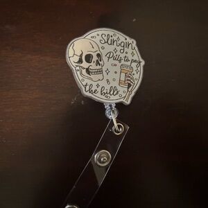 Skull Badge Reel - 'Slingin' Pills to Pay the Bills'